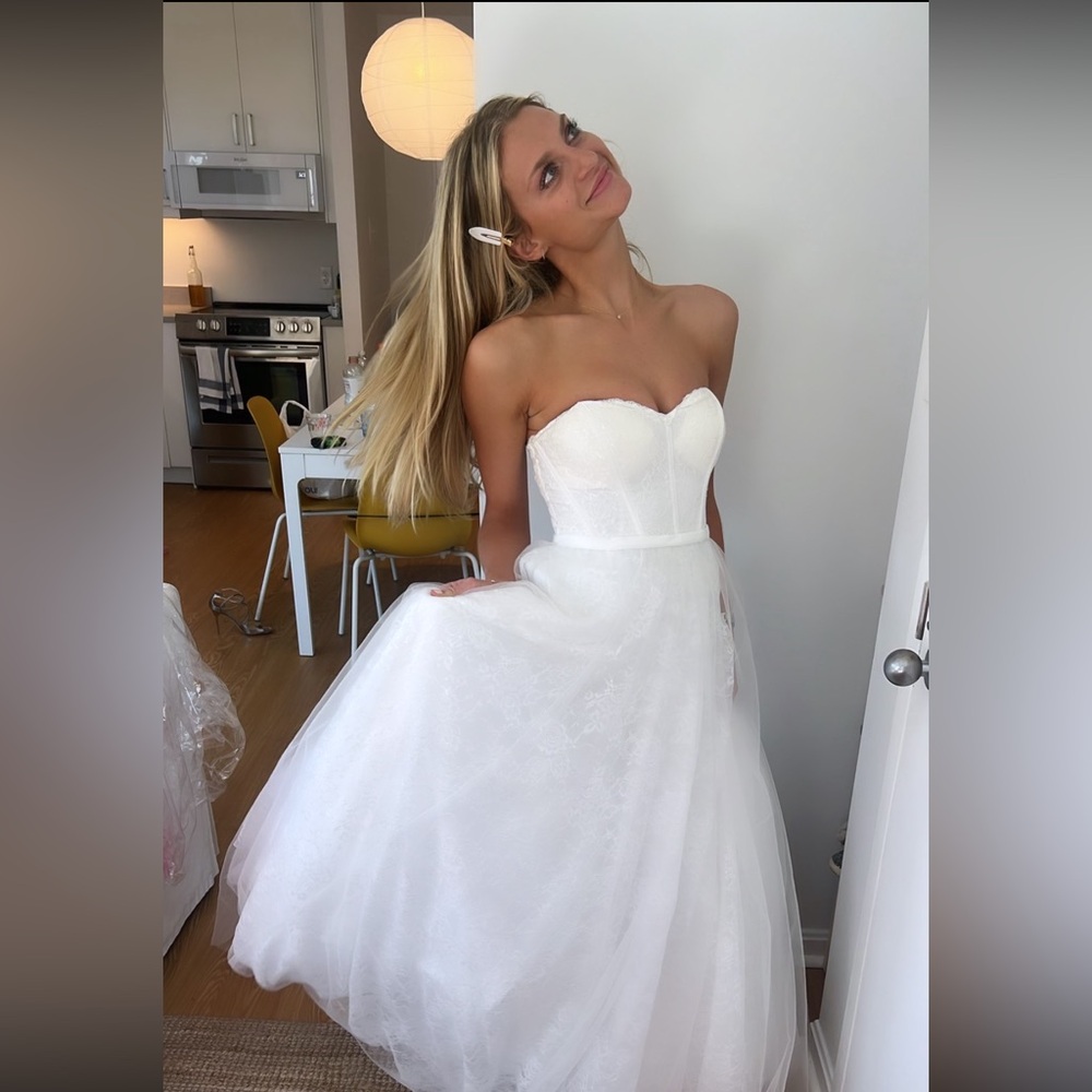 Strapless lace and tulle corset wedding dress